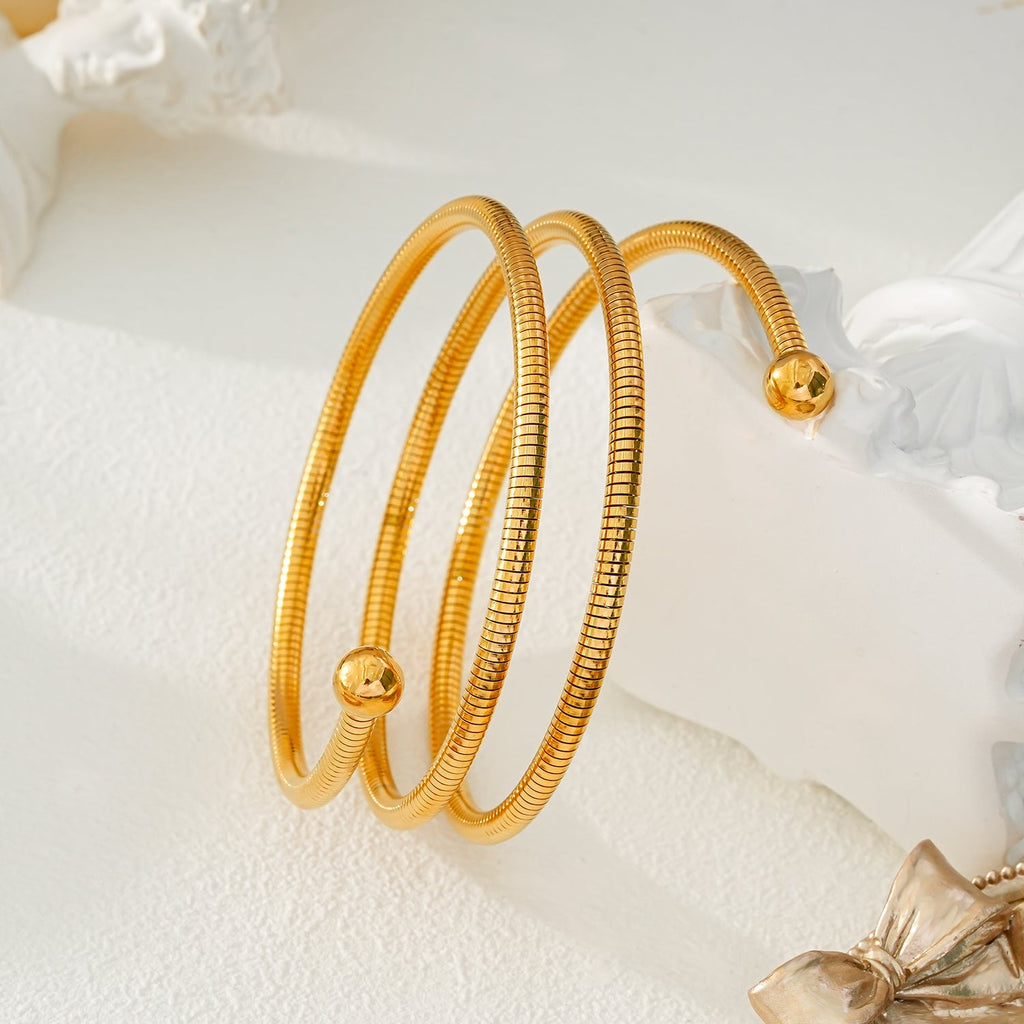 BASHEE: Triple Stacked Gold Bracelet with Surface Lines & Ball Bead Accents. - MacroPanora