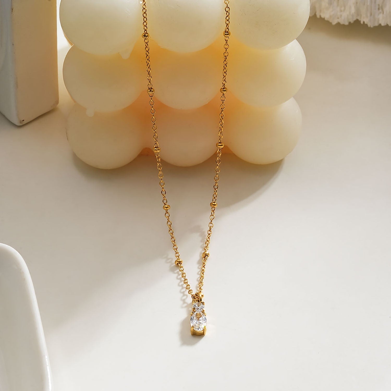 CABBANA Gold: A Duo Set of Zirconia Charm Pendants on a Beaded Chain Necklace - MacroPanora