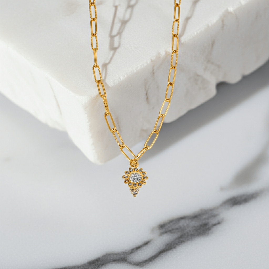 FRETTA: Radiant Star Shaped Pendant Zirconia Paper-Clip Chain Necklace in Gold. - MacroPanora