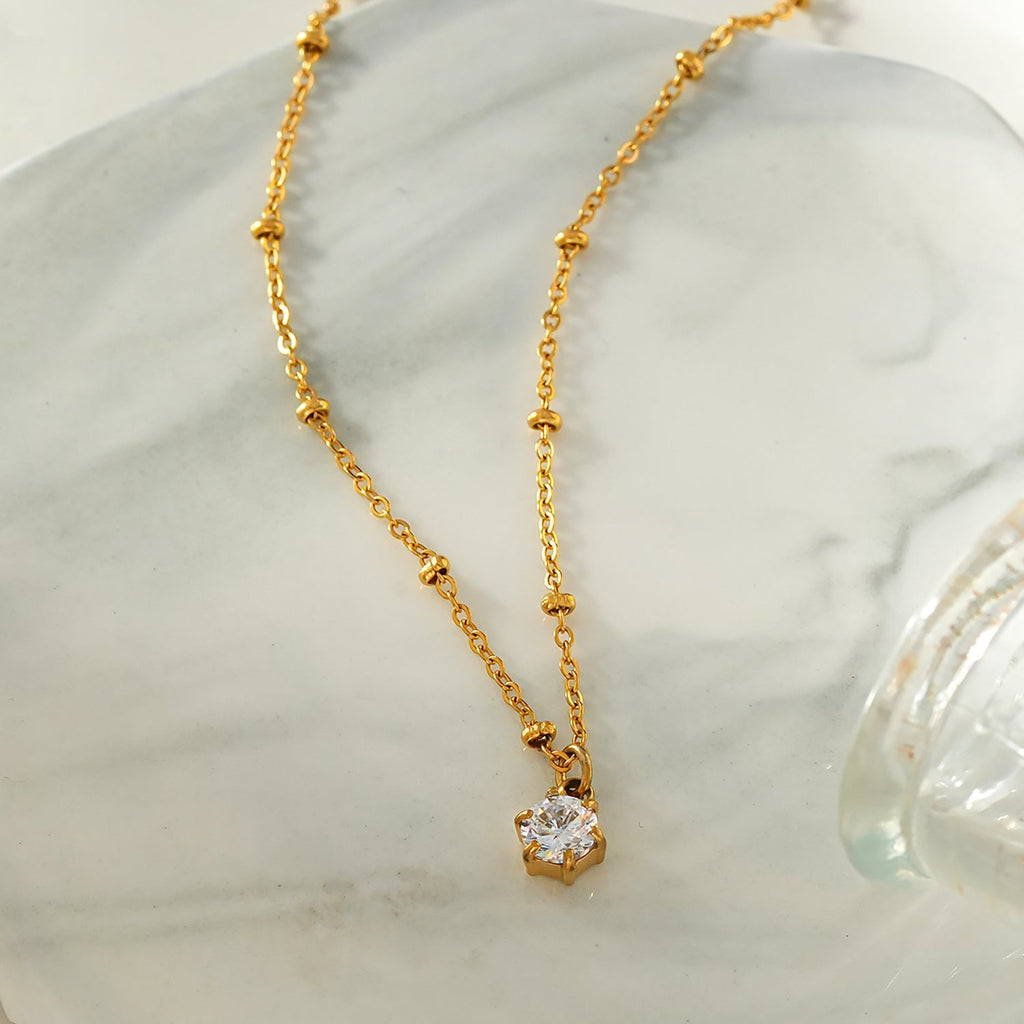 KADIRI Gold: Solitaire Zirconia Charm Pendant on a Beaded Chain Necklace - MacroPanora