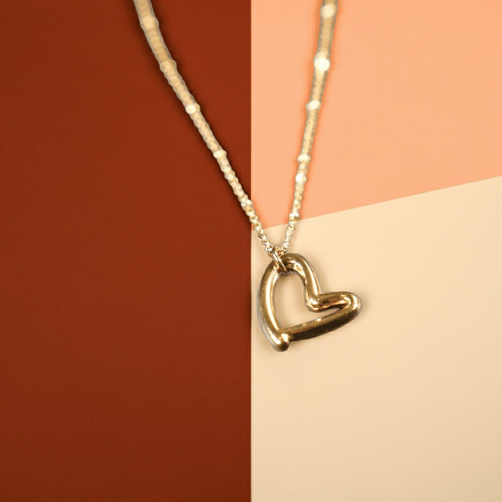 SMITTEN Gold: Dainty Beaded Chain Anchoring an Abstract Heart Shaped Pendant - MacroPanora