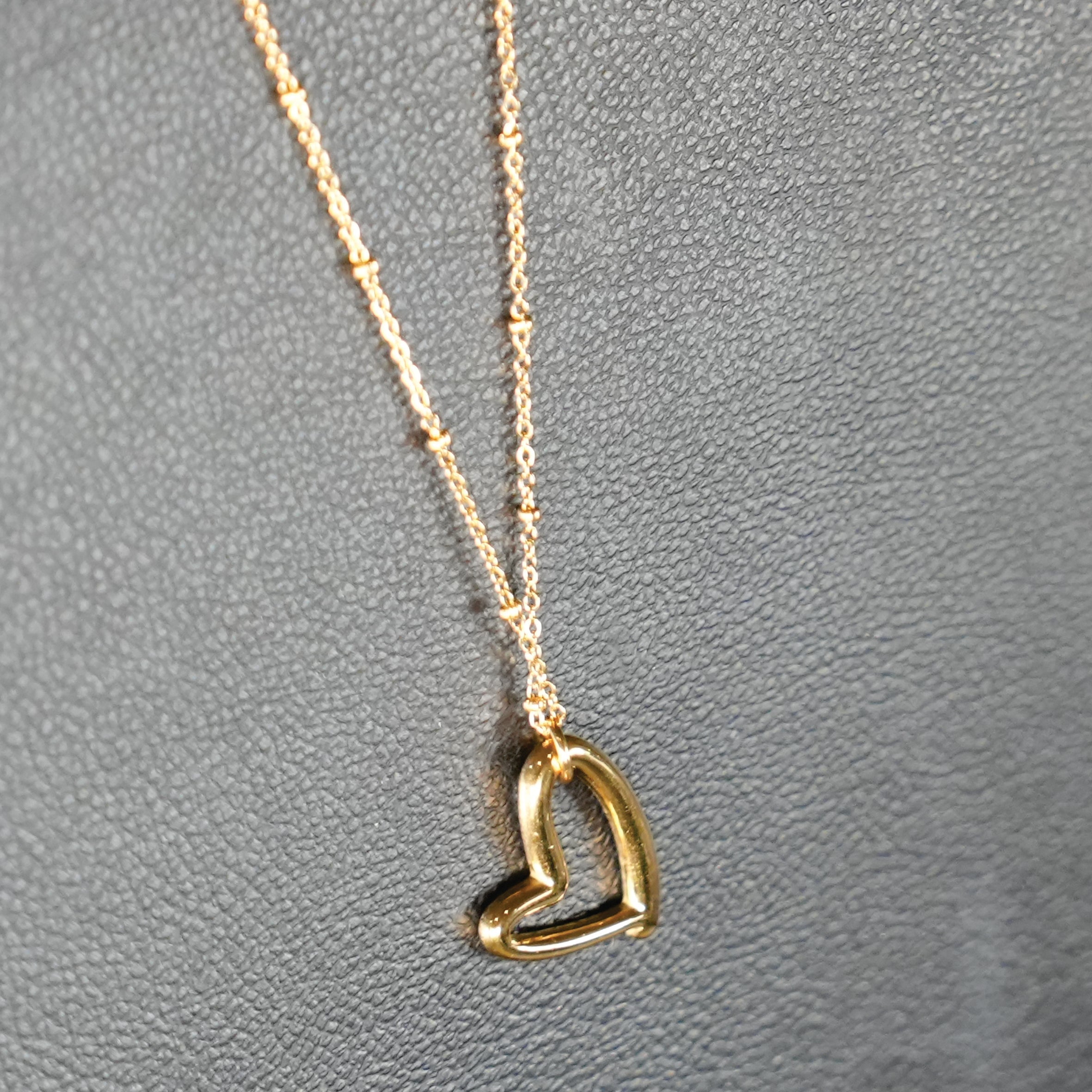 SMITTEN Gold: Dainty Beaded Chain Anchoring an Abstract Heart Shaped Pendant - MacroPanora