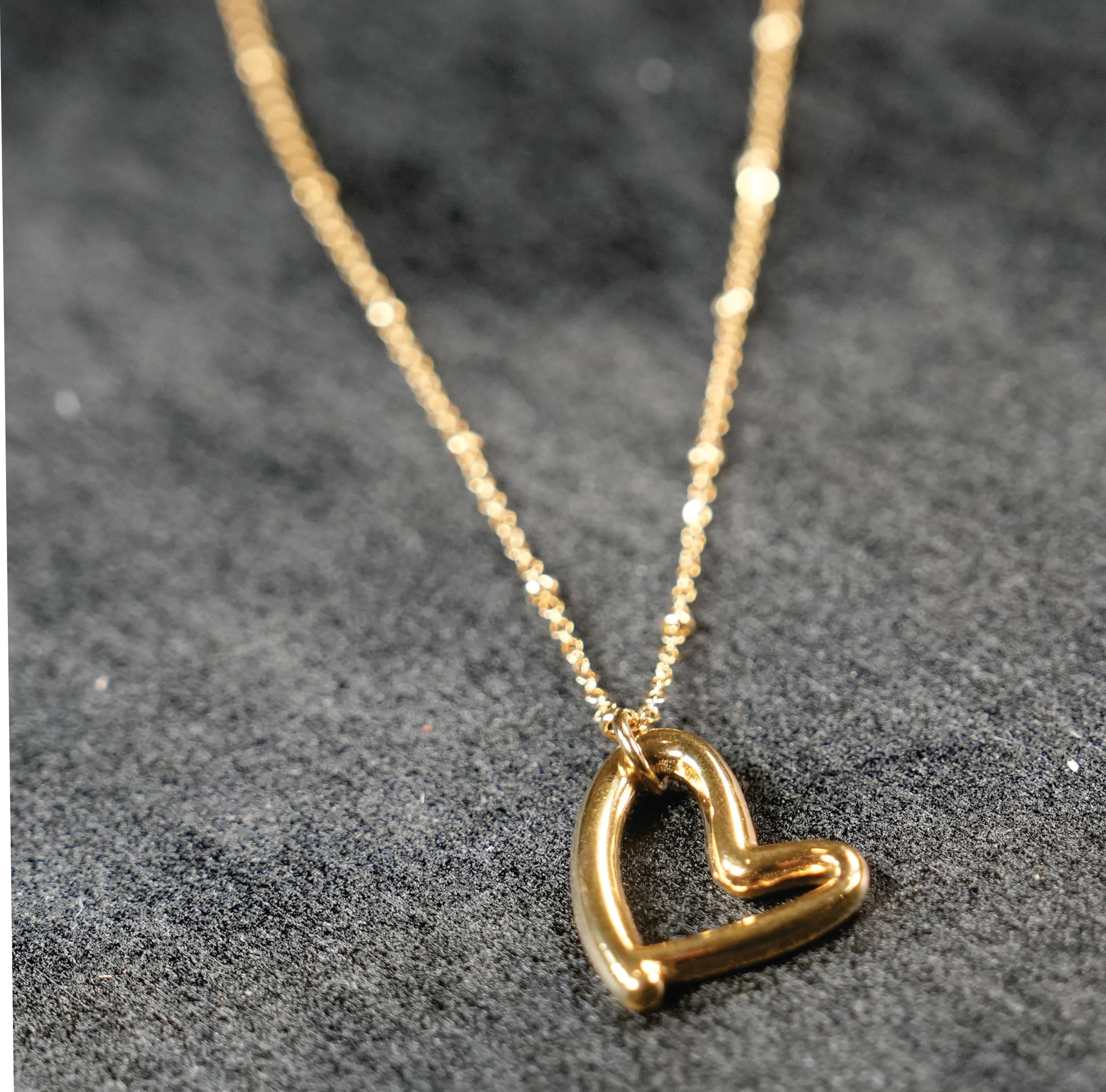 SMITTEN Gold: Dainty Beaded Chain Anchoring an Abstract Heart Shaped Pendant - MacroPanora