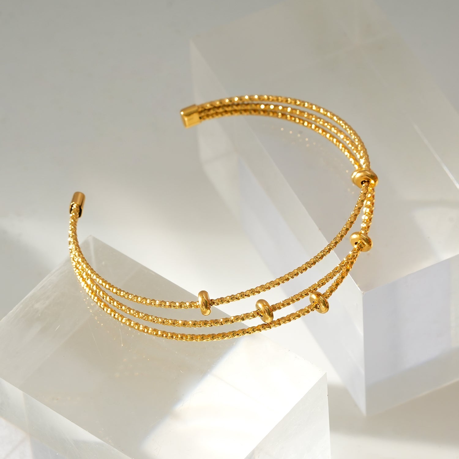 Style FARZIKA Gold: Triple Stacked Textured Beaded Bracelet - MacroPanora