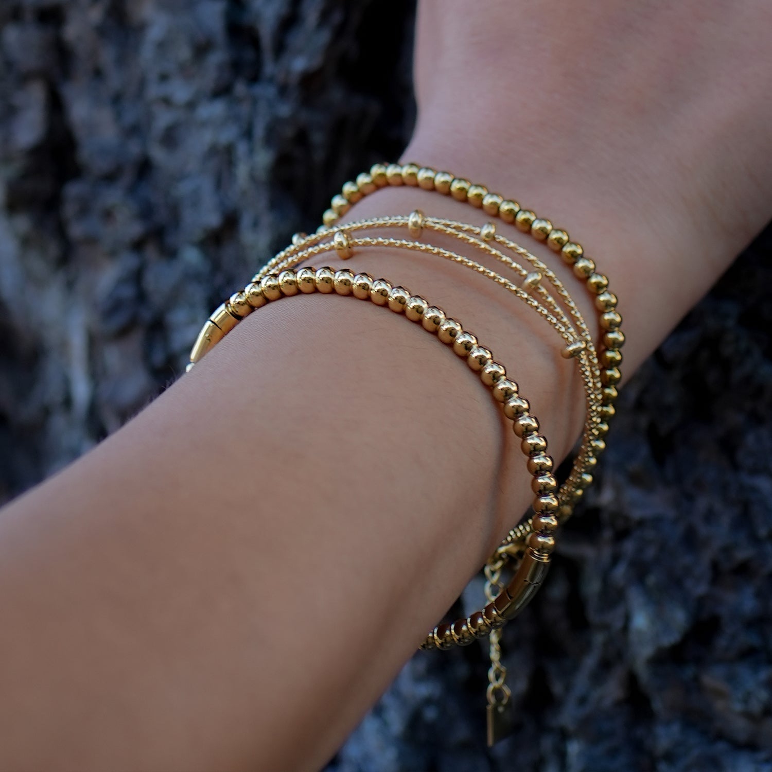Style FARZIKA Gold: Triple Stacked Textured Beaded Bracelet - MacroPanora