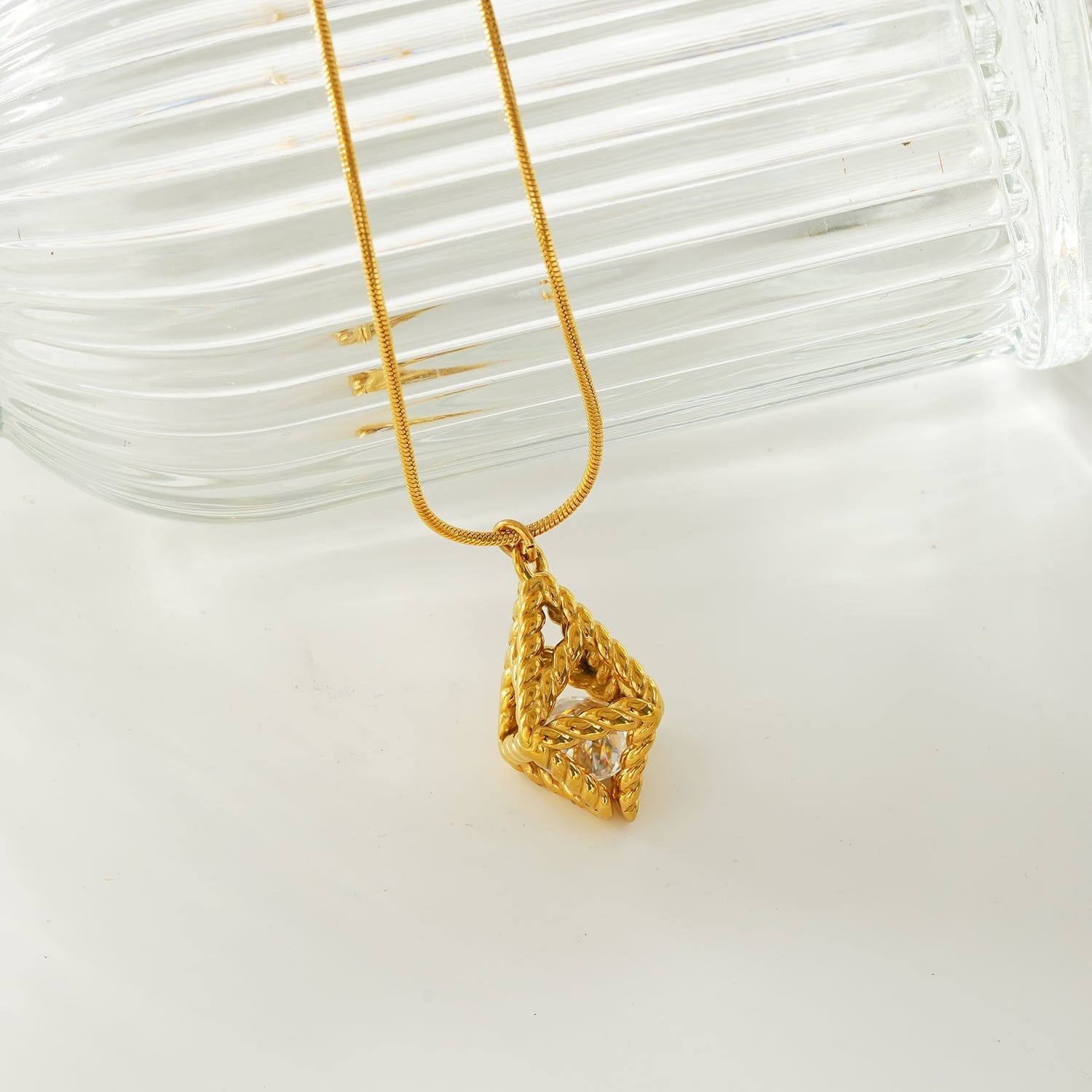 Style KARJAT: Gold Chain Necklace with Geometric Caged Zirconia Pendant - MacroPanora