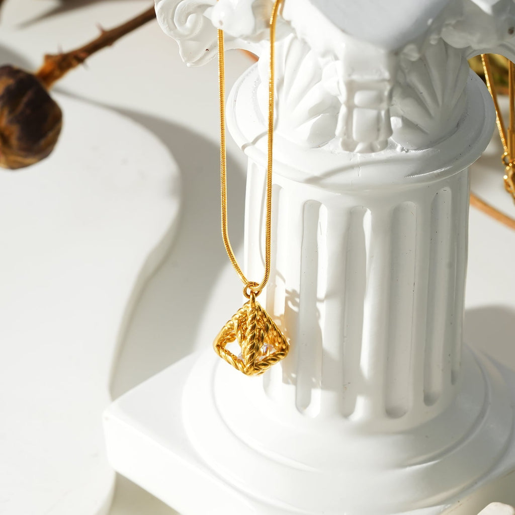 Style KARJAT: Gold Chain Necklace with Geometric Caged Zirconia Pendant - MacroPanora
