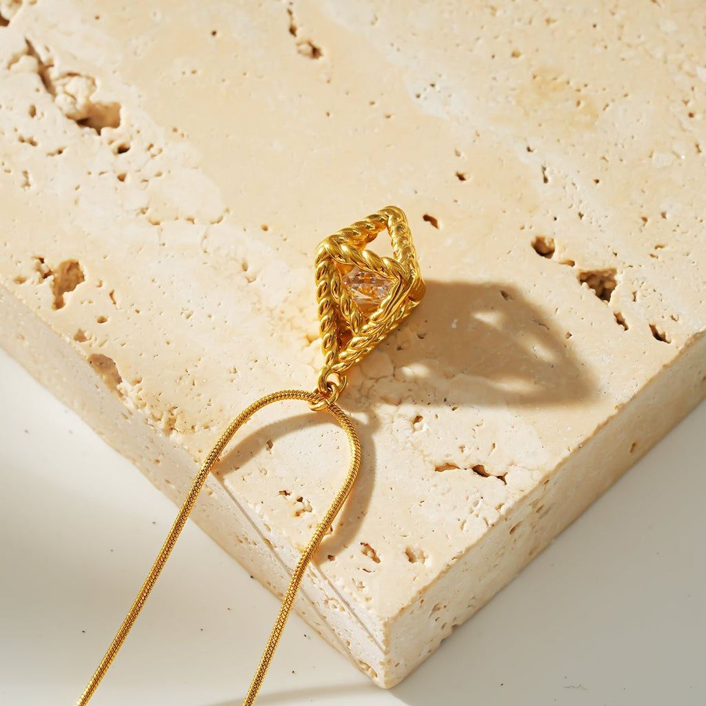 Style KARJAT: Gold Chain Necklace with Geometric Caged Zirconia Pendant - MacroPanora