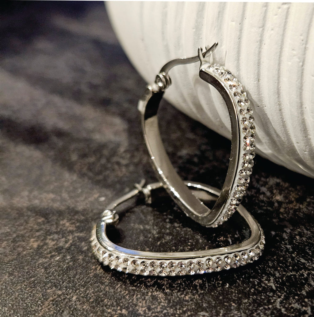 Style MELFI Silver: Abstract Heart Shaped Hoops embedded with Zirconia Gemstones - MacroPanora