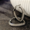 Style MELFI Silver: Abstract Heart Shaped Hoops embedded with Zirconia Gemstones - MacroPanora