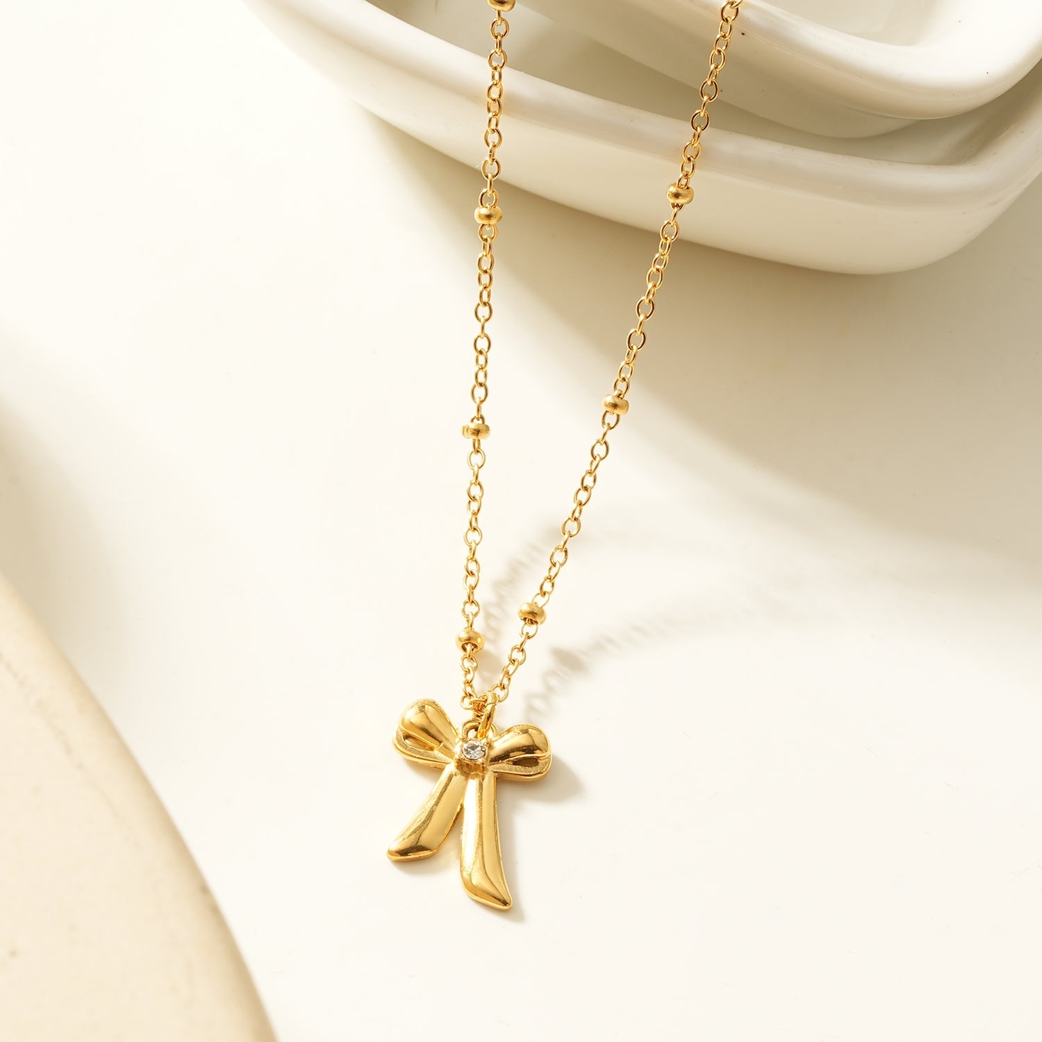 TALIANA Gold: Dainty Beaded Chain Necklace with Bow Pendant & Solitaire Zirconia – Elegant Everyday Jewelry - MacroPanora
