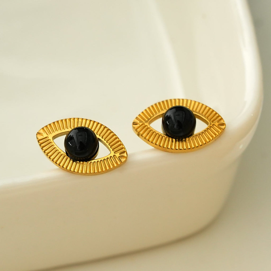 TAVIRA: Gold Evil Eye Studs with Black Onyx Embellishment - MacroPanora