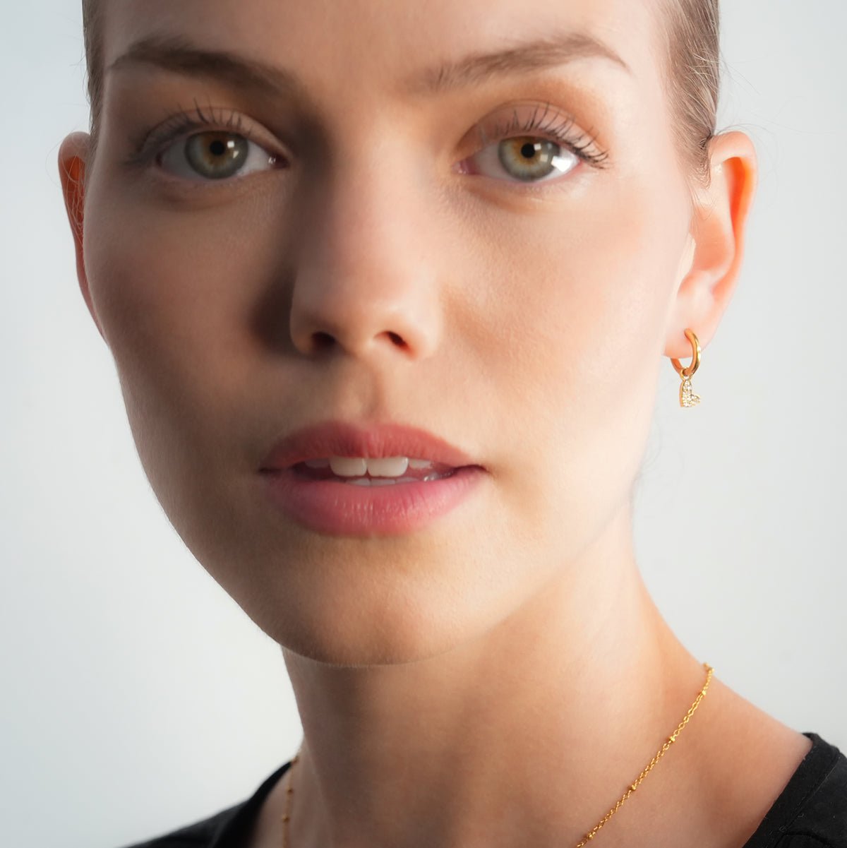 VIRTUOUS Gold: Mini Hoops with Zirconia Embedded Heart Charm - MacroPanora